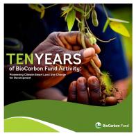 Image of BioCarbon Fund 10 Years booklet with hands and seedling. 